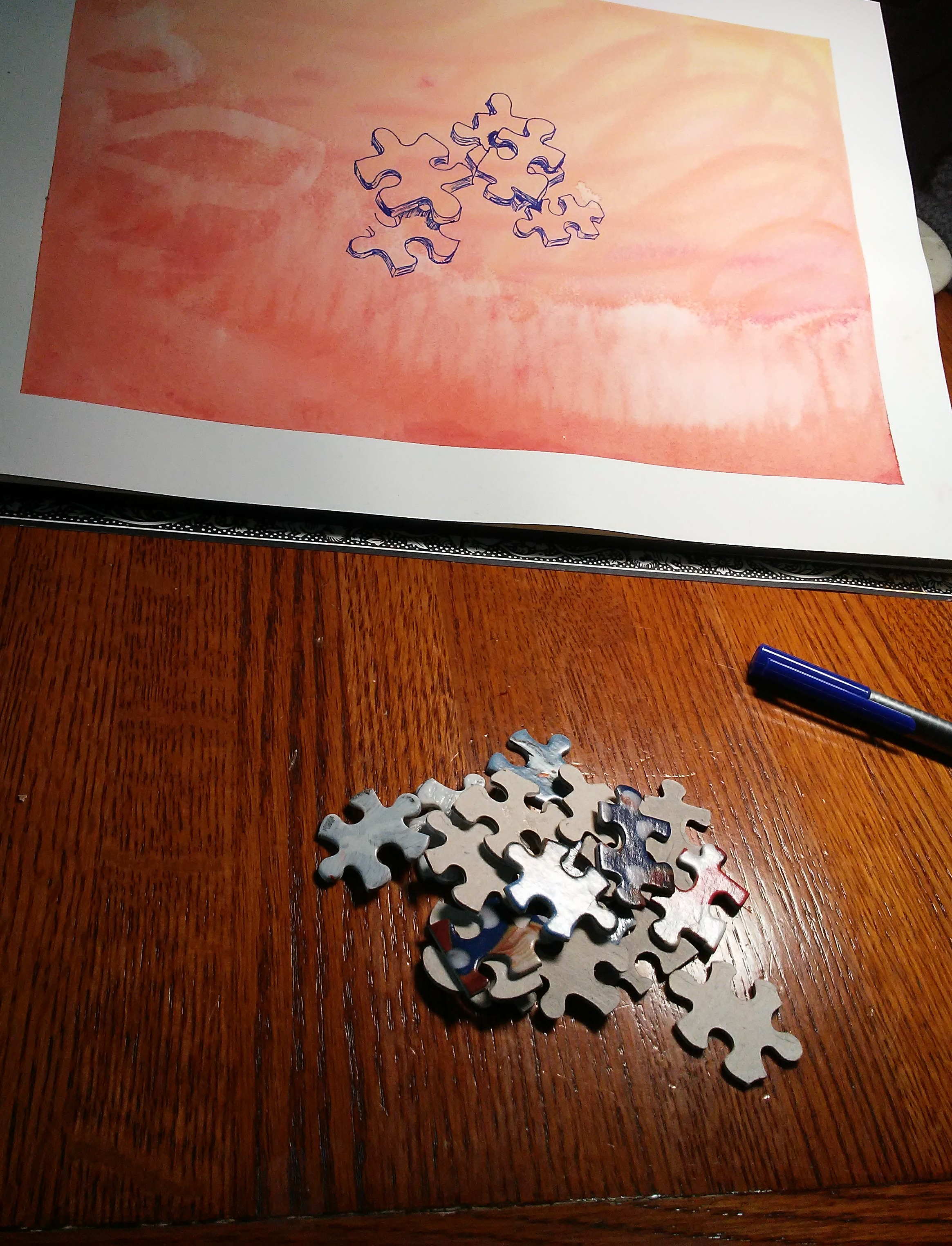 jigsaw puzzle pieces and a drawing of jigsaw puzzle pieces