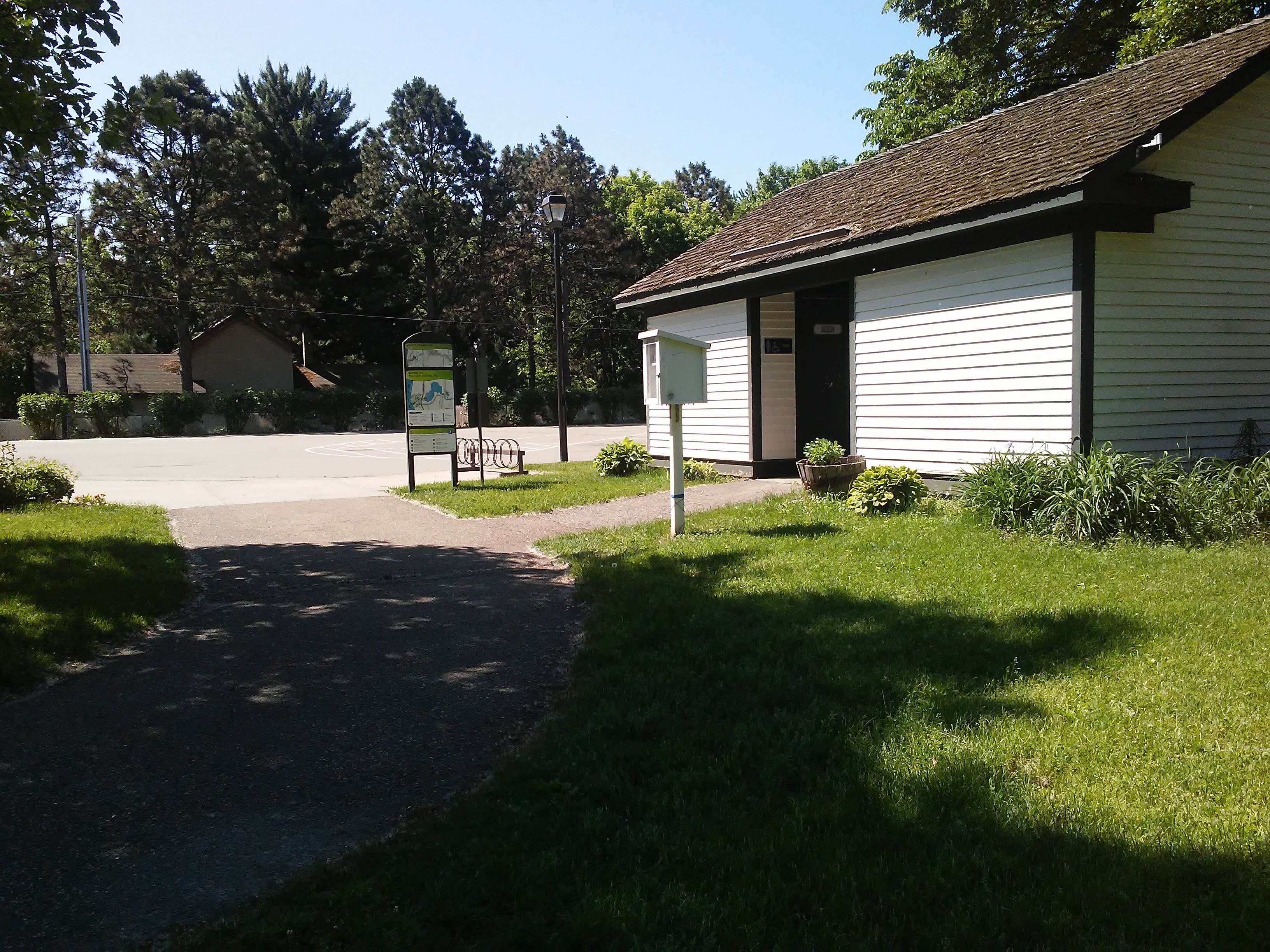 white building and park sign