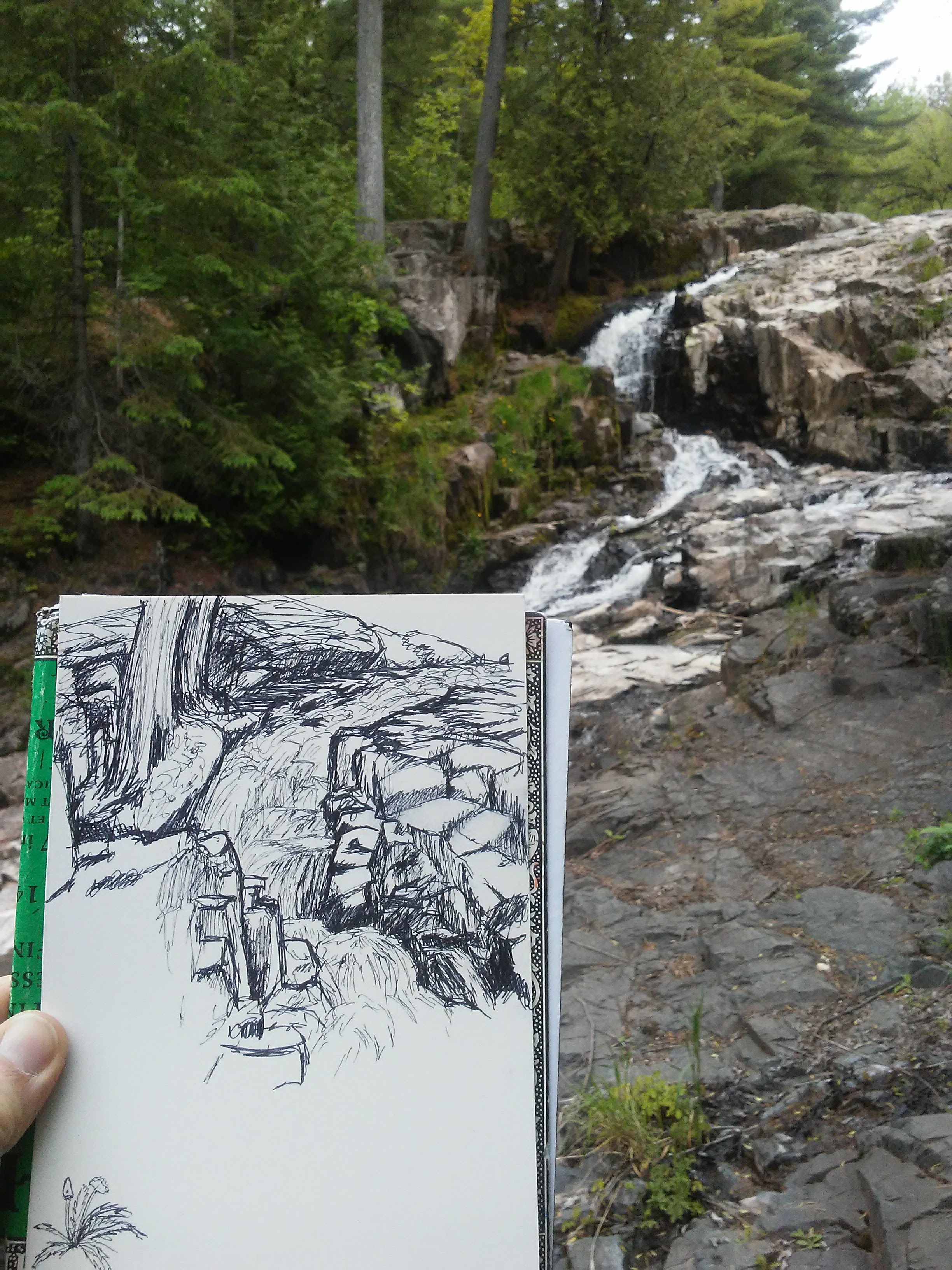 sketch of a waterfall in the foreground and the waterfall in the background